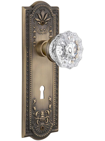 Meadows Door Set with Fluted-Crystal Glass Knobs and Keyhole Single Dummy in Antique Brass.